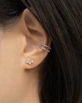 Silver ear stack featuring Nirvana studs and Astraea ear cuff | thehexad