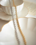Square chain link choker necklace in gold and silver by The Hexad Jewelry