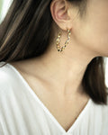 Square chain link hoop earrings crafted in gold plated metal