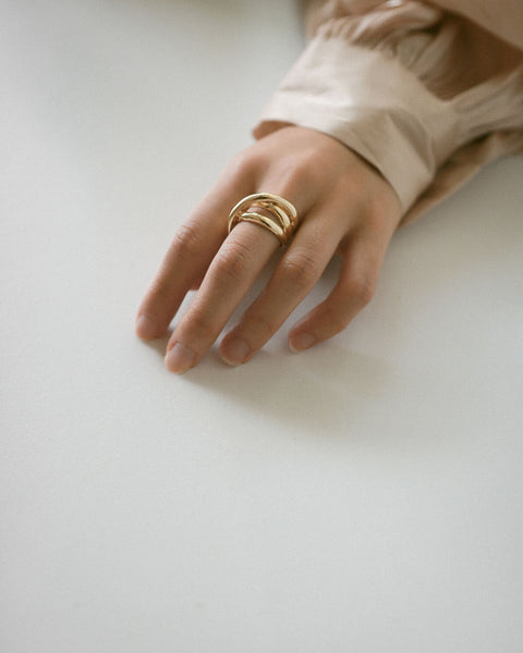 This unique statement gold ring with interesting layers will add depth to your ring look - The Hexad