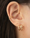 achieve the effect of multiple piercings with the hexad's illusion earrings like the triad cuffs and baby trio hoops
