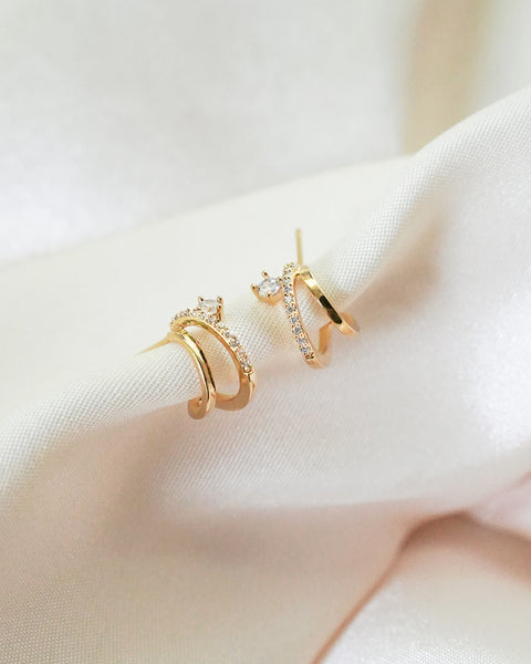 add a layered effect to your next ear party with the dainty intrigue illusion earrings