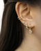 a glittering ear stack with the hexad's diamond hoop earrings and tiny stud earrings