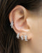 a stunning trio of silver diamond huggie hoop earrings for first to third lobe piercings