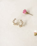 beautiful stud earrings designed with winding branches and miniature leaves in gold