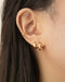 build a modern everyday ear stack with the timeless cuff and hoop earring designs from the hexad