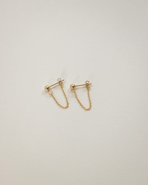 cable chain and ball drop style sud earrings in gold by the hexad