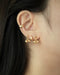 chic ear stack featuring tiny studs and ear cuffs by the hexad