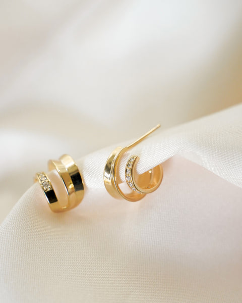 chic elegant atlantis illusion hoop earrings crafted in gold and cubic zirconia