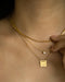 chic necklace stack featuring 18k gold plated solitaire necklace and 1967 tag pendant necklace