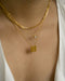 chic neck stack featuring 1967 vintage necklace, solitaire pendant necklace and the parallel chain in gold