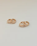chic rose gold kira huggie hoop earrings designed for everyday ensemble @thehexad