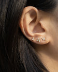 classy ear stack idea comprising small diamond stud earrings from the hexad newest garden of eden collection