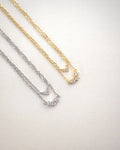 close up sparkly details of the aria necklace pendants in gold and silver - thehexad