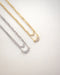 close up sparkly details of the aria necklace pendants in gold and silver