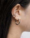 contemporary ear stack look featuring the hexad wave ear cuff and hoop earring in silver