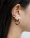 contemporary ear stack look featuring the hexad wave ear cuff and hoop earring in silver