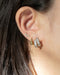 contemporary ear stack made up on oracle double hoops, capri huggie earring and nirvana stud
