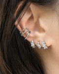 curated modern silver ear party with gemstone embellished huggie hoop earrings and retractable ear cuffs by the hexad