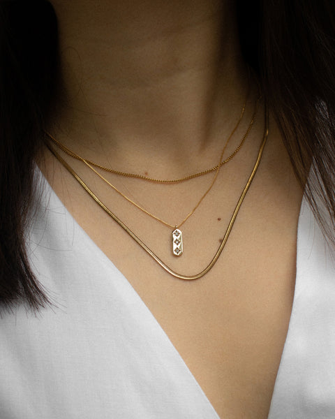 delicate chain necklaces with whimsical pendant engraved with stars