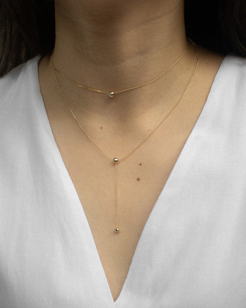 delicate gold chain with tiny ball beads by the hexad