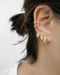 diamond embellished ear stack comprising divine huggie hoops and cosmic ear cuffs