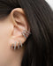 ear party inspo with the silver four claw earrings by contemporary jewelry label the hexad
