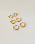 everyday huggie hoop earrings in gold plated steel by the hexad