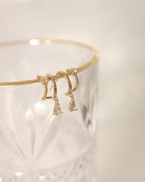 delicate earrings with dainty drop charm from the hexad