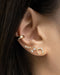 fun ear stack ideas with unique gold studs in various shapes and designs | the hexad