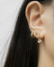 fun huggie hoops with cute hanging charms for a quirky ear stack in modern rose gold
