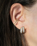 glittering ear stack comprising oracle double hoops and blaze ear cuffs in gold