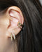 golden ear stack comprising reverie illusion earring, retractable hoop and bullet ear cuff from the hexad