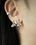hoop earrings and mini ear studs layered for a perfect stack