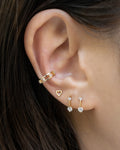 how to curate everyday ear stacks with minimalist earrings and cuffs by jewelry label the hexad