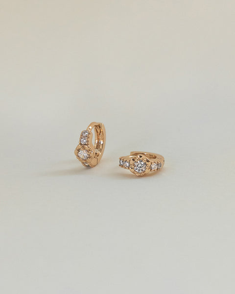 lovely gold hoop earrings with intricate flower rose design details by the hexad label