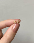 miniature classic cross shape ear studs in gold