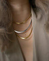 mix gold and silver necklace chains in a chic cascading stack for office and runway