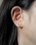 modern ear party featuring corsage illusion earring, eve baguette stud and cosmic ear cuff