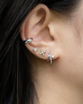 modern ear party featuring intrigue illusion earring, micro studs and bestselling cult ear cuff in silver