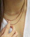 parallel and basic rose gold chain necklaces layered for a trendy neck stack