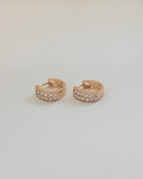 rose gold hoop earrings crafted with finely detailed diamonds for luxe sophistication