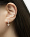 shiny heart charm dangle earring by the hexad brand
