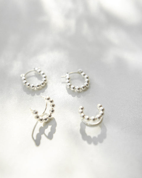 Modern style hoop earrings and ear cuffs for a silver ear stack