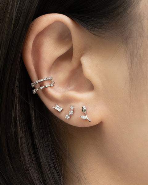 silver ear stack comprising the hexad garden of eden stud earrings and astraea ear cuff