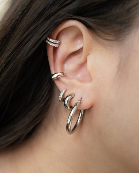 silver ear stack featuring Suzi Hoops and ear cuffs by The Hexad