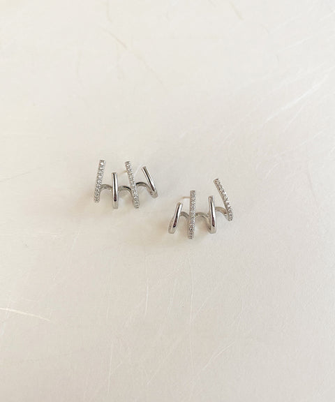 silver four claw earrings by contemporary jewelry label the hexad