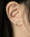 silver tiny stud earrings and petite huggie hoops by The Hexad Jewelry