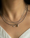 simple and pretty neck stack consisting of solitaire necklace, teardrop necklace, box cut chain and basic chain in silver