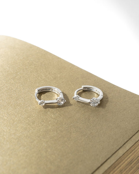 simple classy hoop earrings in silver with petite diamonds by sophisticated women jewelry label the hexad